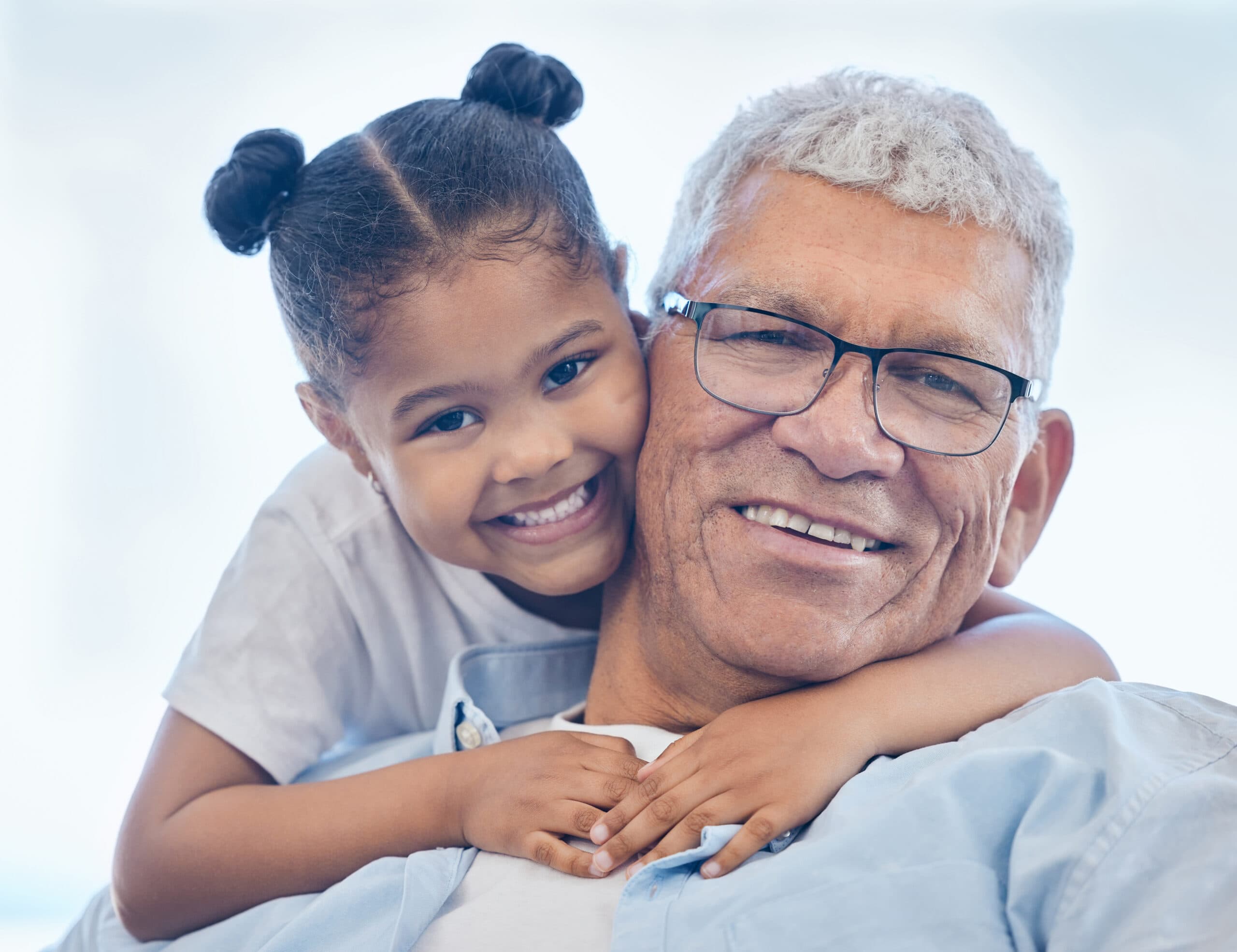 Grandfather and granddaughter embracing - grandparent DNA testing